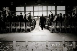 Bride and groom exiting through ceremony windows