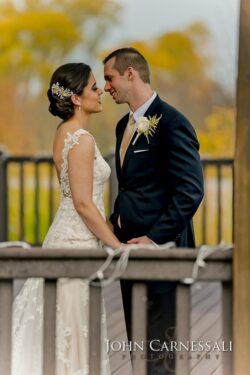 Bride and groom sharing quiet moment on deck
