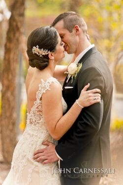 Bride and groom embracing under warm sunset