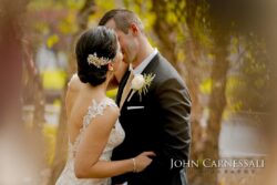 Closeup kiss with bride's hairpiece