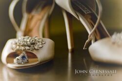 Elegant shoes with a diamond ring.