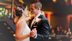 Newlyweds sharing first dance, smiling