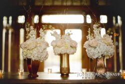 Elegant floral arrangements in decorative vases.