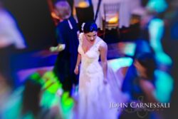 Bride dancing at a vibrant wedding reception.