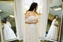 Bride in wedding dress with mirror reflections.