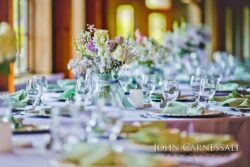Reception table with floral centerpiece and glassware