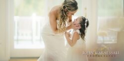 Bride bending to kiss flower girl