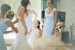 Bride with bridesmaids and a young girl.