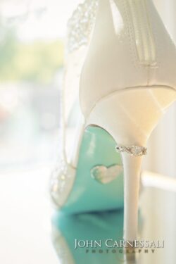 White bridal shoe with intricate details.