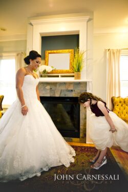 Bride and child in elegant white dresses.
