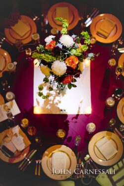 Overhead burgundy table with floral centerpiece