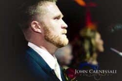 Man in suit with focused expression.