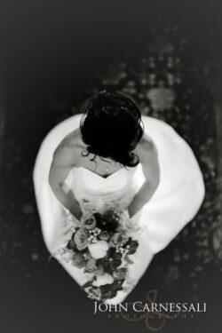 Monochrome top-down bride holding bouquet