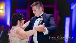 Mother and groom dancing at wedding reception.