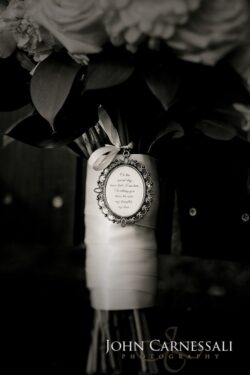 Bridal bouquet with decorative charm and ribbon.