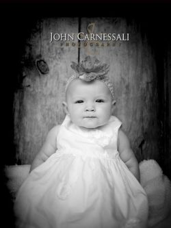 Black and white portrait of a young child in a dress
