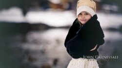 Young child wearing a knit hat outdoors