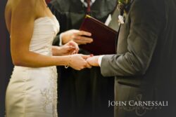 Close-up of hands and wedding ring details.
