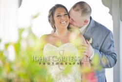 Bright portrait of the bride and groom standing together