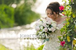 Bride holding a bouquet during an outdoor portrait.