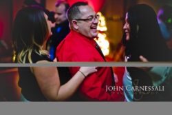 Wedding guest smiling during the reception celebration.