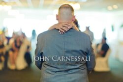 Bride and groom embracing during the wedding reception.