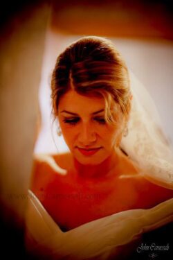 Close-up portrait of the bride in warm window light