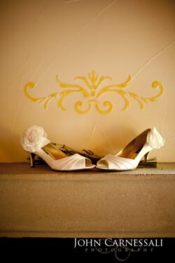 White bridal shoes arranged for a wedding detail photo