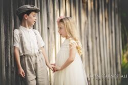 Boy and girl standing together facing each other