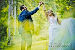 Groom twirling Bride as wedding dress flows