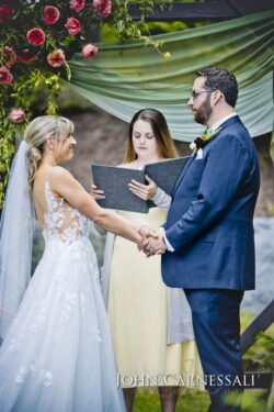 Bride and Groom holding hands during ceremony