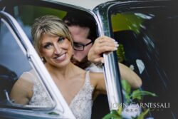 Bride and Groom formal photo in classic car