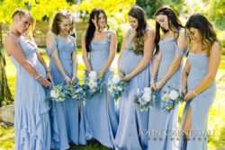 Bridesmaids standing together with bouquets