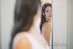 Bride looking at her reflection in a mirror