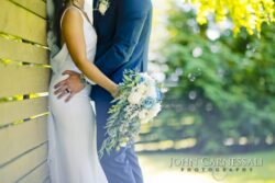 Couple’s hands and bouquet in a close-up detail