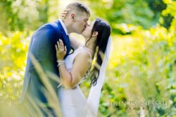 Bride and groom kissing in a close-up portrait