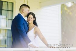 Bride and groom standing close together in soft light