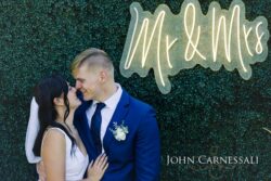 Bride smiling beside the groom outdoors